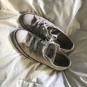 Broken in white converse